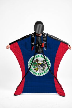 Belize extreme. Men in wing suit templet. Skydiving men in parashute. Simulator of free fall.の写真素材