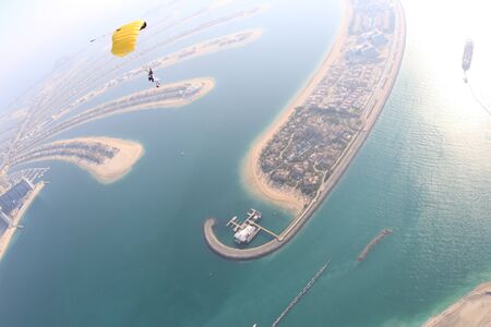 Hobbies. Free people prefere active sports. Bird men conquers sky. Flying people in black suit. Extreme as a hobby.の写真素材