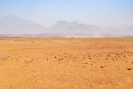 Hot desert on a background of mountainsの写真素材