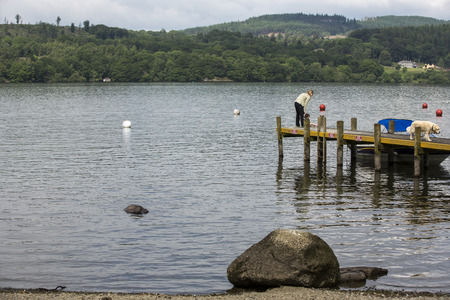 Windermere, England  - June 14  Small boats on lake Windermere, on June 14, 2014, in Windermere, Lake District, England  Windermere is the largest natural lake in England のeditorial素材