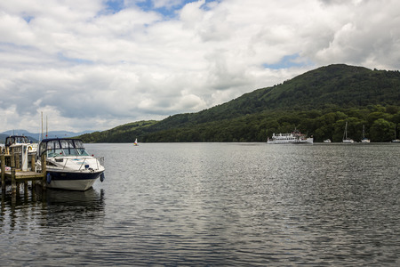 Windermere, England  - June 14  Small boats on lake Windermere, on June 14, 2014, in Windermere, Lake District, England  Windermere is the largest natural lake in England のeditorial素材