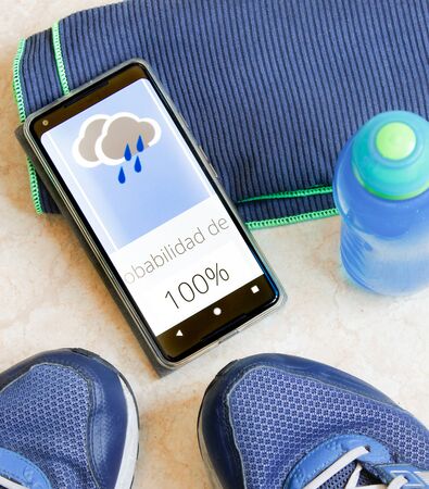 Sports equipment and mobile with the weather forecastの写真素材