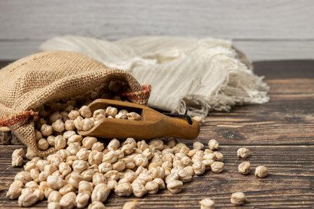 Sack of chickpeas on wooden table. Close upの写真素材