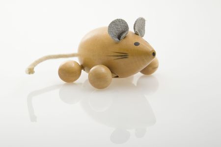 wooden mouse painted on white backgroundの写真素材