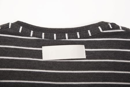 blank t-shirt label on striped texture clothの写真素材