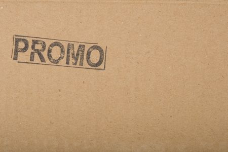 promo message, copy-space on brown cardboard textureの写真素材