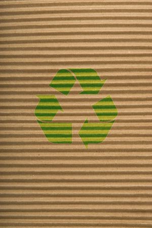 brown corrugated cardboard texture, striped horizontally paper and green recycling signの写真素材