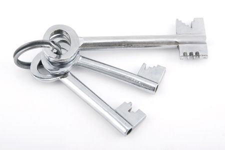 silver bunch of keys on white backgroundの写真素材