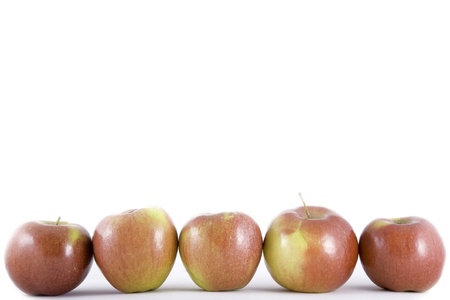 front view of five red apple isolated on white の写真素材
