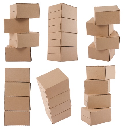 Brown cardboard boxes arranged in stack on white backgroundの写真素材