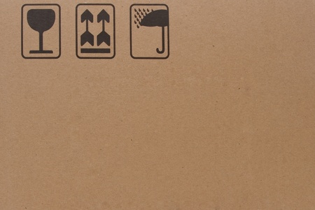 close-up of grunge black fragile symbol on cardboardの写真素材