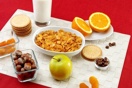 Delicious breakfast foods over red fabric backgroundの写真素材
