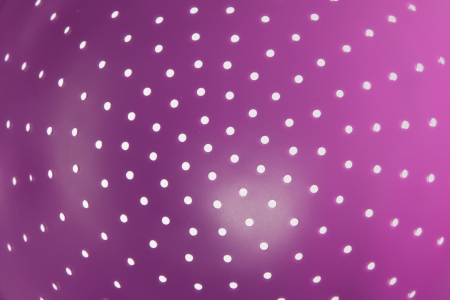 white polka dots on purple spheric shape