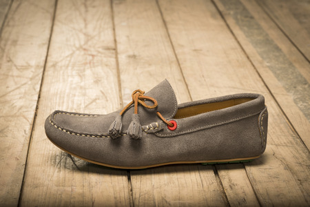 Men's Loafer Shoe on old wood backgroundの写真素材