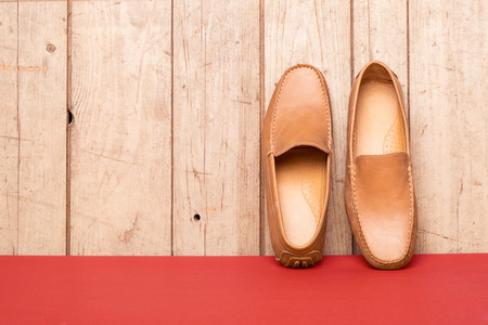 Men's Loafer Shoe on old wood backgroundの写真素材