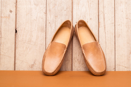 Men's Loafer Shoe on old wood backgroundの写真素材