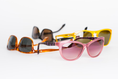 sunglasses on white background with long shadowの写真素材