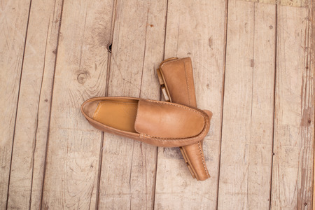 Men's Loafer Shoe on old wood backgroundの写真素材