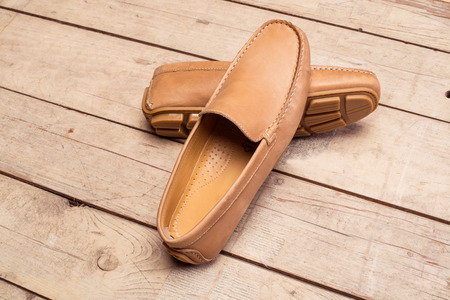 Men's Loafer Shoe on old wood backgroundの写真素材