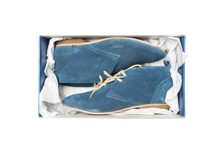 blue shoes in box isolated on white backgroundの写真素材