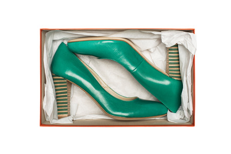 high heel shoes in box isolated on white backgroundの写真素材