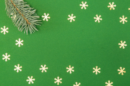 Christmas card with fir and snowflake on green backgroundの写真素材