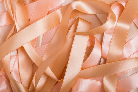 Macro of beautiful beige satin ribbon backgroundの写真素材