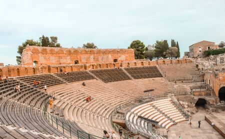 View of the Ancient Theater of Taormina with a cloudy skyの写真素材