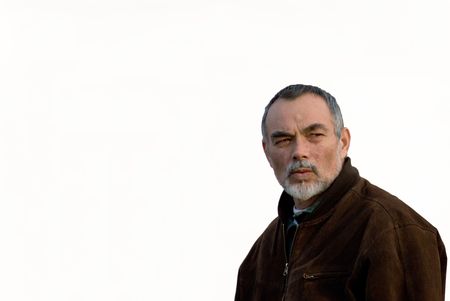 elderly man in brown jacket