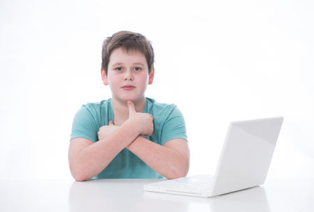 young boy working  with laptopの写真素材