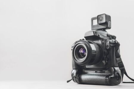 Action camera with a professional camera on a white background.の写真素材