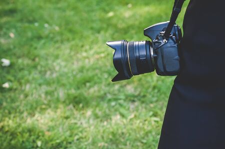 Professional photo, video camera. against the background of green grassの写真素材