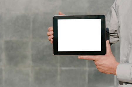 Close up, Mock up tablet, presentation of business plan, man hands. against the background of a...