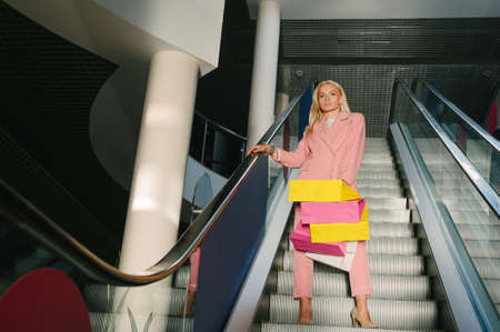 Happy woman with bags, enjoying your shopping. Concept on the theme of Black Fridayの写真素材