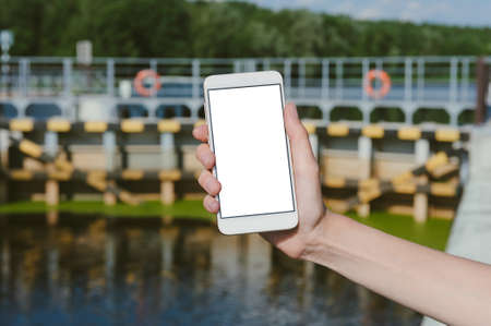 Mock-up of a smartphone on the background of the crossing over the waterworksの写真素材