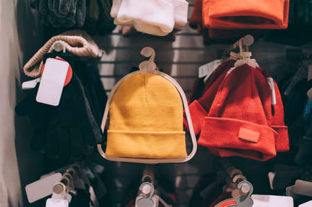 Modern winter hats on a showcase in a supermarketの写真素材