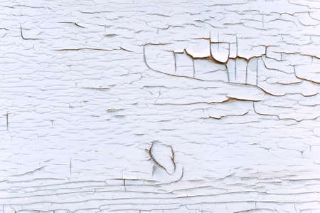 Close-up, texture of peeling white paint from woodの写真素材
