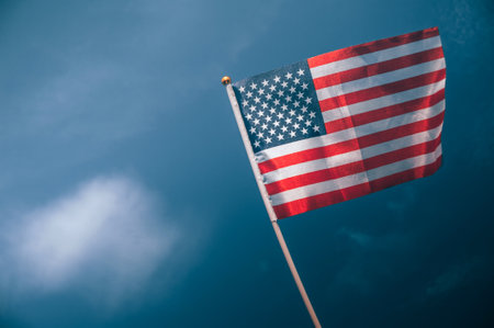 American flag, on against a overcast skyの写真素材