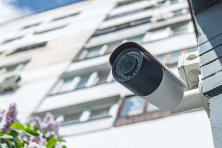 Surveillance camera against the backdrop of a white house