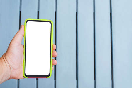 Close-up, Mockup of a smartphone in a man's hand on a background