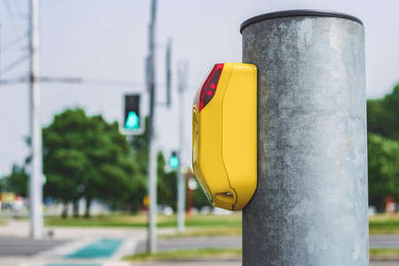 Close-up of a pedestrian crossing traffic light switch