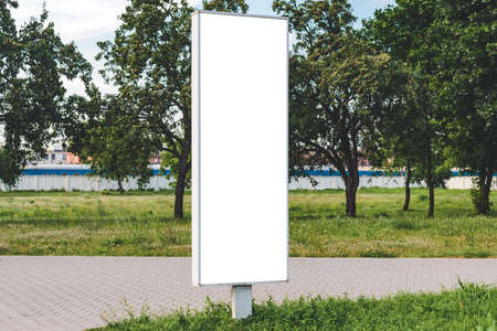 Blank billboard mockup. Against the backdrop of urban nature. business conceptの写真素材