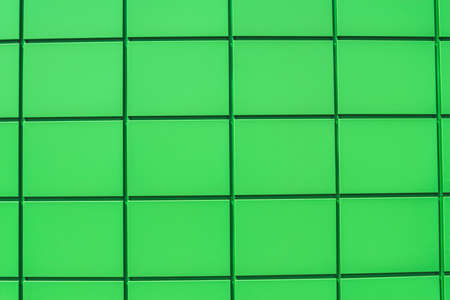 Close-up, texture of the green metal panel of a modern building. Abstract backgrounds for designの写真素材