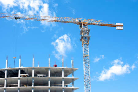 Tower crane on the background of construction