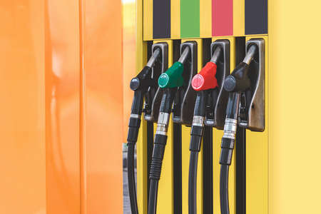Petrol station with colored guns and fuel hoses. Gasoline, diesel, eco hydrogen refueling column.. Close-upの写真素材