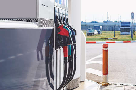 Gas station with gasoline and diesel fuel. Refueling gun close-up