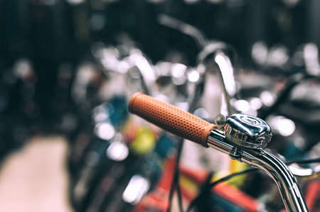 Close-up, a bell on the handlebars of a bicycle in a supermarket