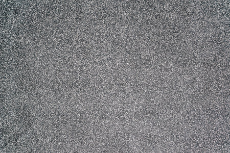 Close-up texture of a wall made of fine granite chips in black and white. House facade decor backgroundの写真素材