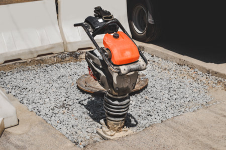Close-up of a vibrating rammer on the roadの写真素材