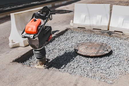 Close-up of a vibrating rammer on the roadの写真素材